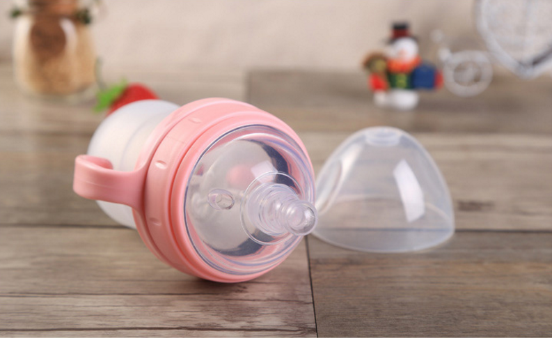 Baby's bottle with spoon